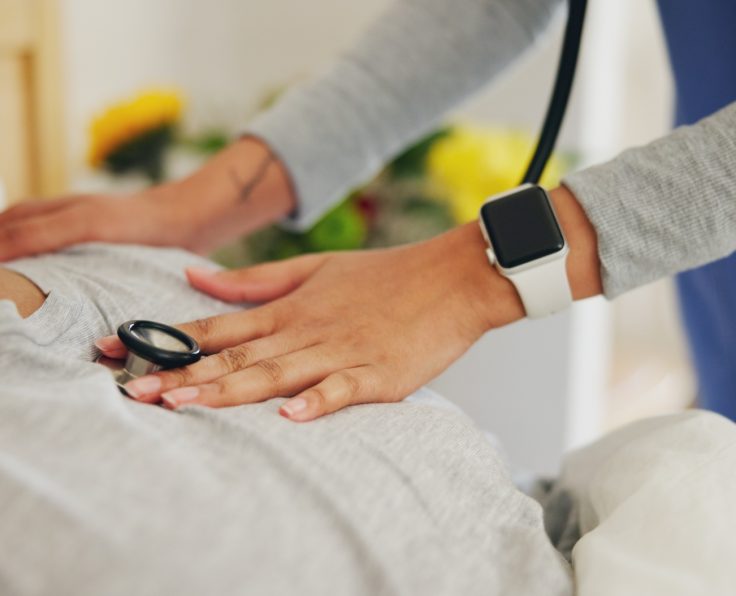 Doctor, hands and checking patient heart beat with stethoscope for healthcare or monitoring at home