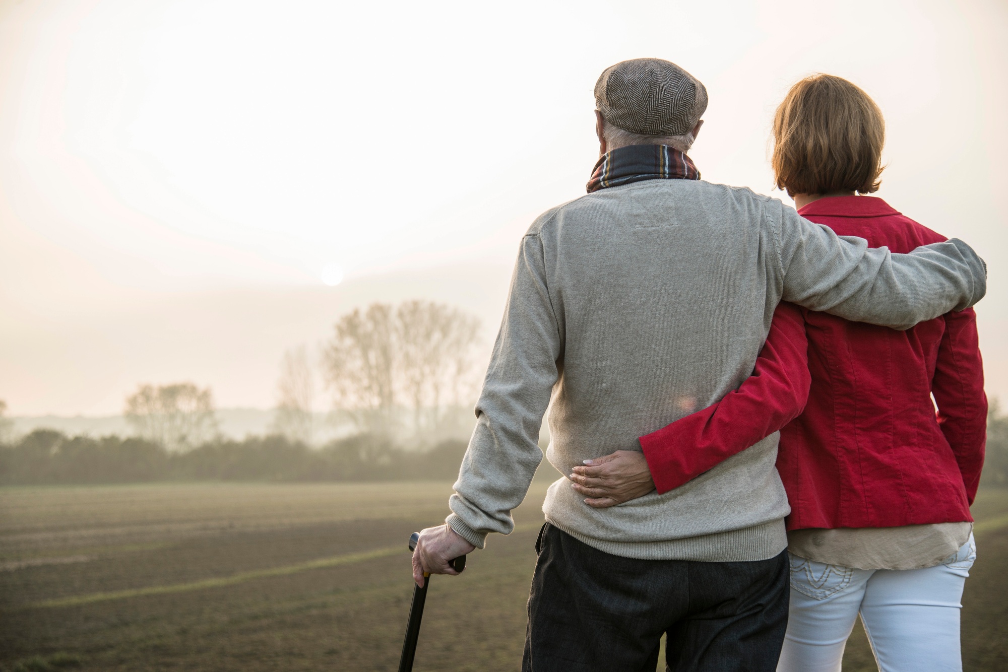 Senior man and daughter in rural landscape