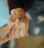 Mature lady being comforted with empathy in her golden years