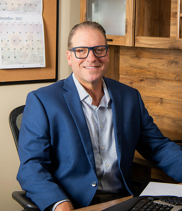 Photo of Dr. Steven Giss in a blue suit