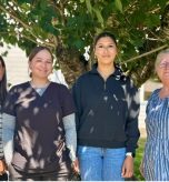 Kelly Thompson, CNO; Taz Wachendorf, MAC, Clallam Bay Medical Clinic; Sylvia Torres, NAC, Extended Care Unit and Acute Care; and Deborah Dillon, Director of Patient Safety & Quality pose in front of a tree.