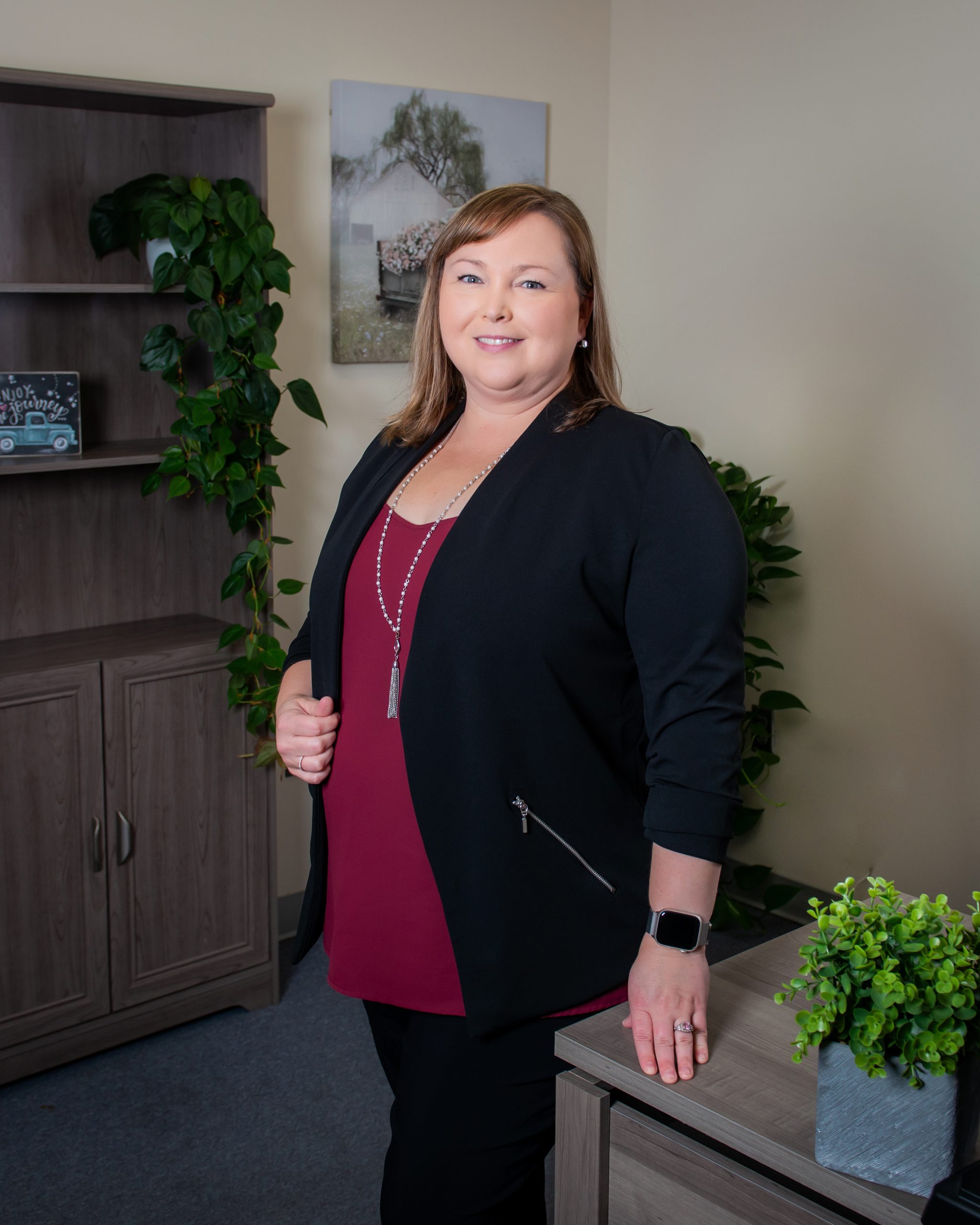 Picture of Kim Hull, Director of Imaging Services standing in a room.